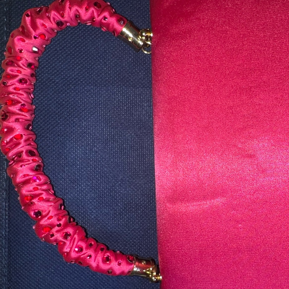 A pink clutch bag. Looks very chic and cute. Very Demure